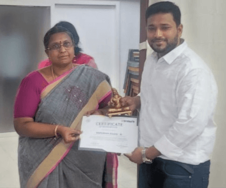 TrueSpur founder receiving the StartupTN government hackathon award from a Tamil Nadu government official